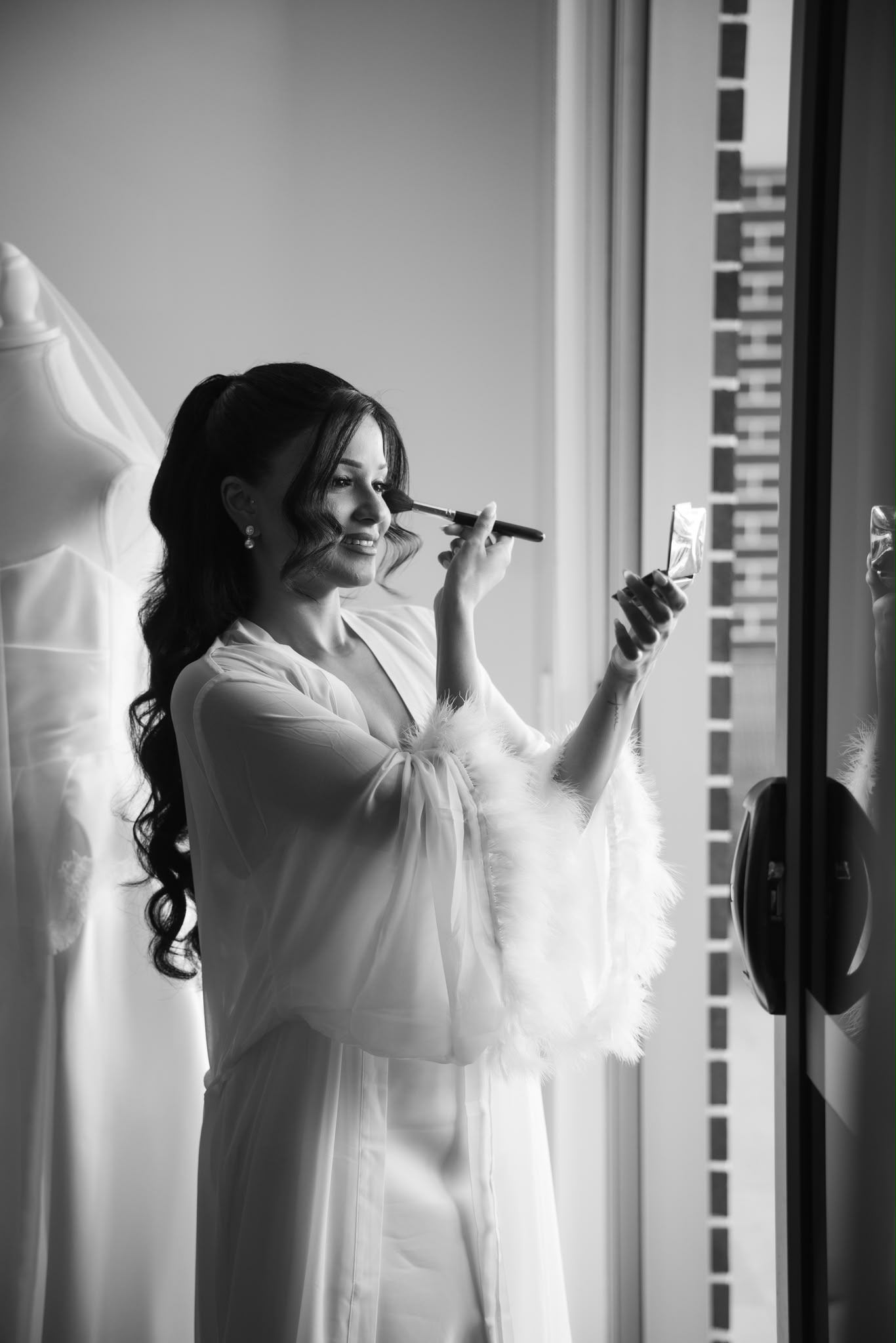 Shay getting ready by the window